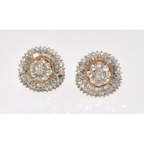 506 - 9ct gold Diamond earrings set in the round halo design with round and baguette stones 1 missing