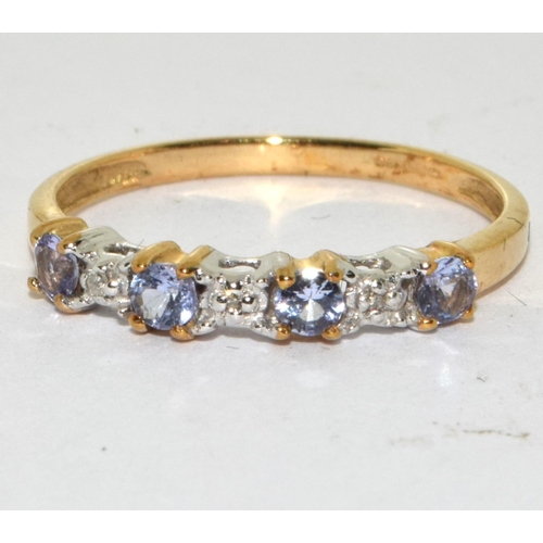 465 - A 9ct gold tanzanite and diamond ring Size L.