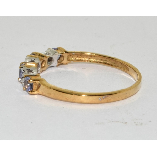 465 - A 9ct gold tanzanite and diamond ring Size L.