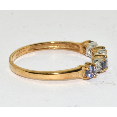 465 - A 9ct gold tanzanite and diamond ring Size L.