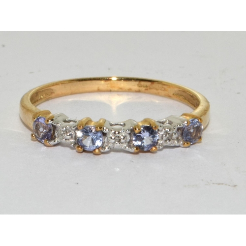 465 - A 9ct gold tanzanite and diamond ring Size L.