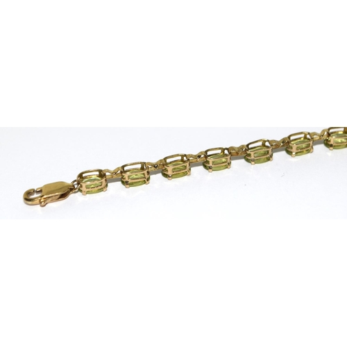 322 - 9ct gold and natural peridot line bracelet 7