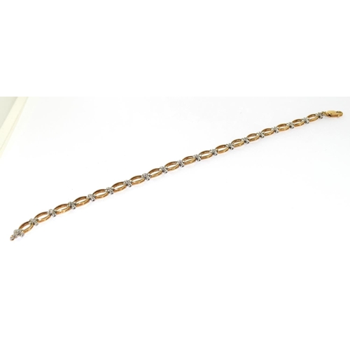 511 - 9ct gold diamond line bracelet 7 1/2