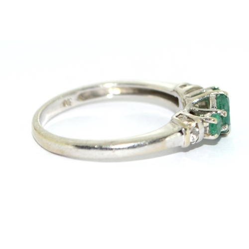 466 - Emerald and diamond trilogy ring in 9ct white gold Size O.