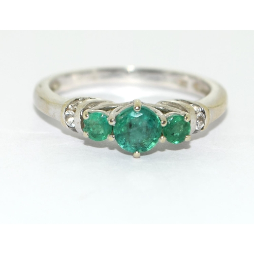 466 - Emerald and diamond trilogy ring in 9ct white gold Size O.