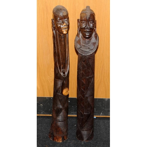 148 - Large floor standing wooden carved figures of an African male and female. Possible fertility connota... 