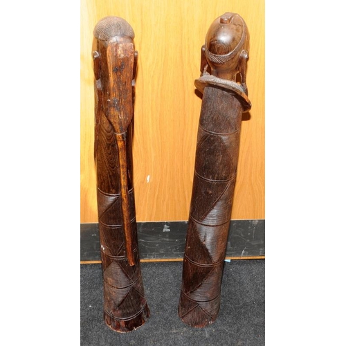 148 - Large floor standing wooden carved figures of an African male and female. Possible fertility connota... 