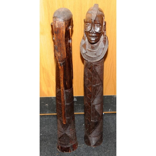 148 - Large floor standing wooden carved figures of an African male and female. Possible fertility connota... 