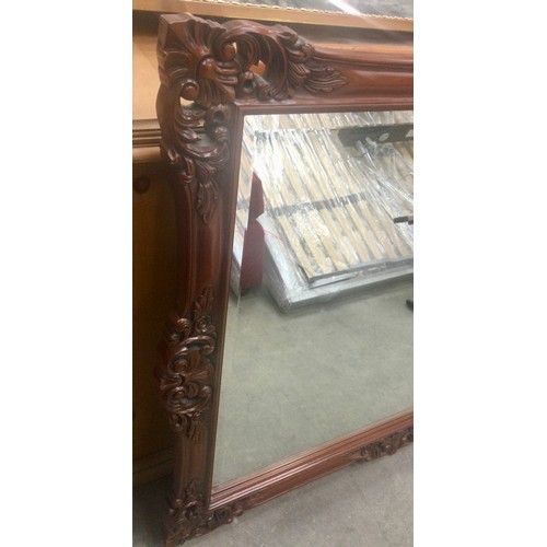 563 - Modern mahogany bevelled edged decorative mirror 111x90cm.