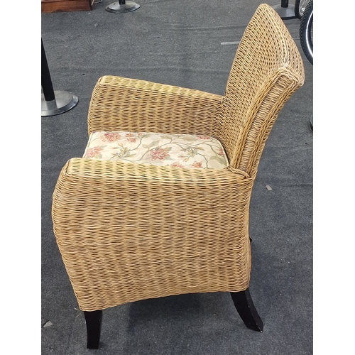 564 - Quality wicker arm chair with shaped back on stub legs 95x50x50cm