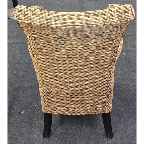 564 - Quality wicker arm chair with shaped back on stub legs 95x50x50cm