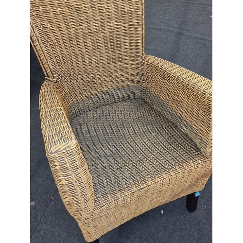 564 - Quality wicker arm chair with shaped back on stub legs 95x50x50cm