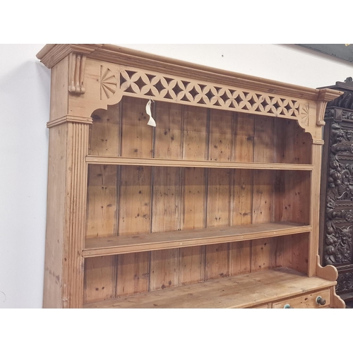 573 - Irish antique pine stepped multi purpose kitchen dresser having twin shelves over triple draws with ... 