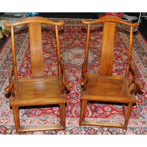 205 - A pair of Chinese late 19th century official yoke back chairs.