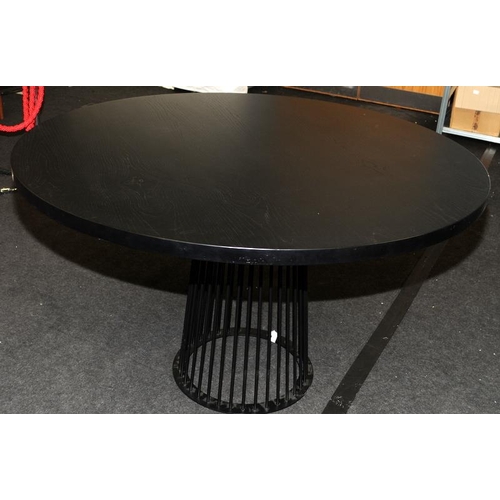 574 - Large circular dining table with solid ebonised to supported by black powdercoated metal carousel st... 