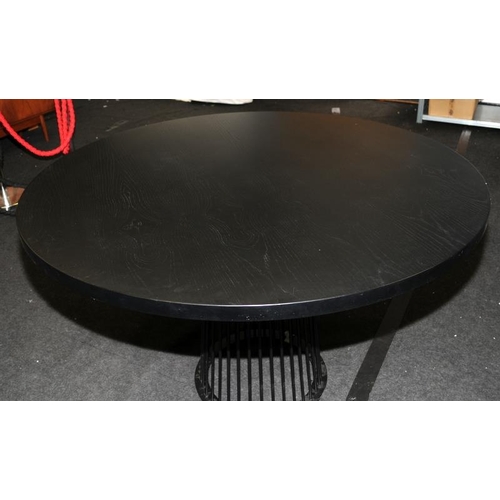 574 - Large circular dining table with solid ebonised to supported by black powdercoated metal carousel st... 