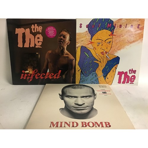 205 - THE THE VINYL LP RECORDS X 3. Titles here are as follows - ‘Mind Bomb’ complete with 2 posters , pho... 