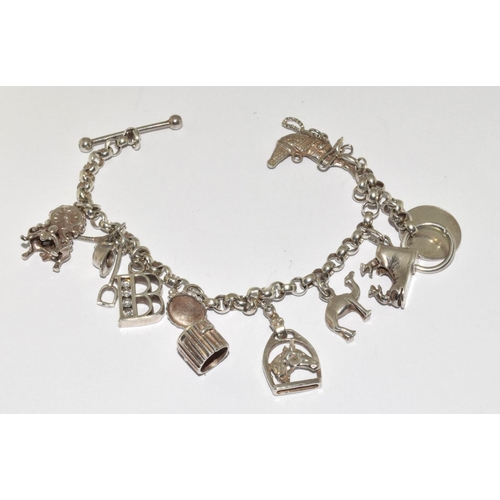 287 - Silver charm bracelet and 8 charms