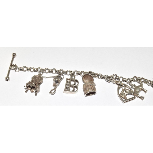 287 - Silver charm bracelet and 8 charms