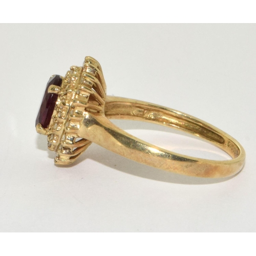 451 - 9ct gold ladies Halo garnet cluster ring size Q