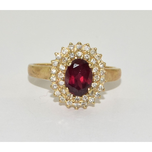 451 - 9ct gold ladies Halo garnet cluster ring size Q