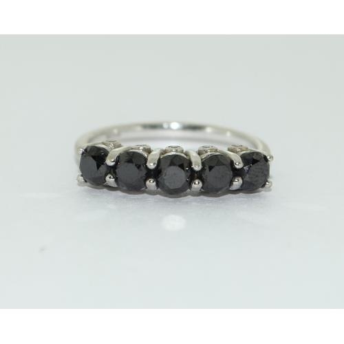 188 - 9ct white gold 5 stone Black Diamond with inset diamonds to sides size N