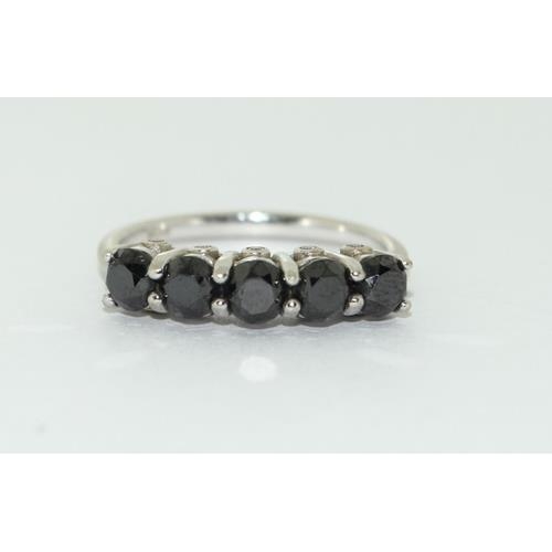 188 - 9ct white gold 5 stone Black Diamond with inset diamonds to sides size N