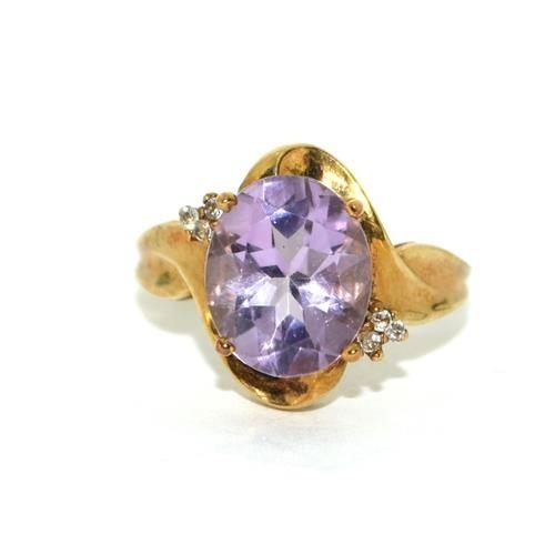 205 - 9ct gold ladies Diamond and Amethyst ring 3.6g size N