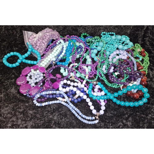 409 - Large quantity of beaded necklaces and bracelets to include Malachite, Jadeite, and Tourquoise