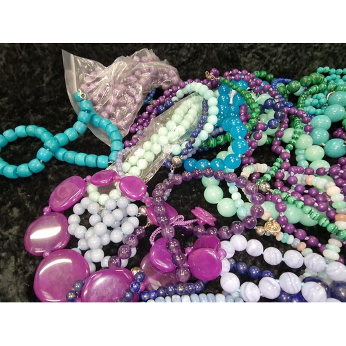 409 - Large quantity of beaded necklaces and bracelets to include Malachite, Jadeite, and Tourquoise