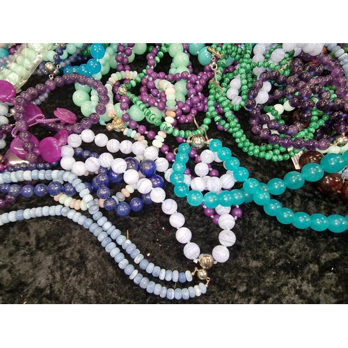 409 - Large quantity of beaded necklaces and bracelets to include Malachite, Jadeite, and Tourquoise