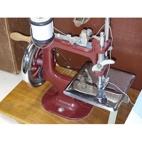 169 - Essex Miniature sewing machine cased with instructions together a 