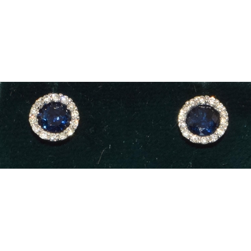 477 - 18ct white gold Diamond and sapphire round halo earrings