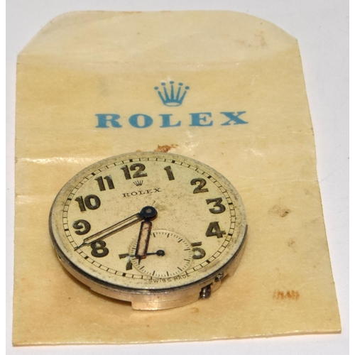 337 - Rolex complete movement, ticks, with Rolex bag.