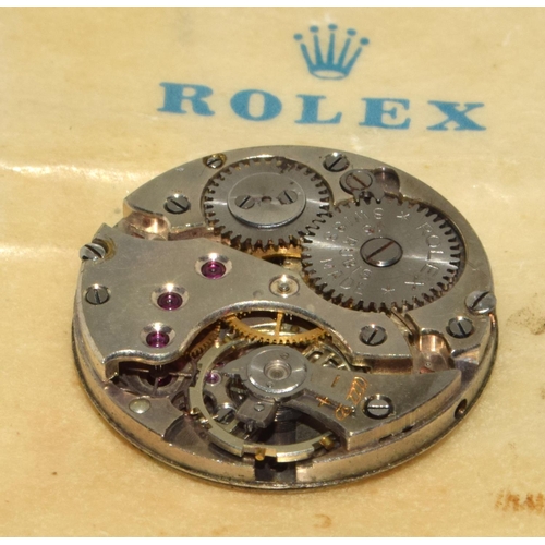 337 - Rolex complete movement, ticks, with Rolex bag.