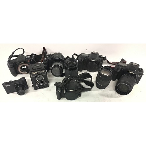 82 - Collection of various cameras and lenses from the makes of Cannon - Lubitel - Sony - Finepix etc.