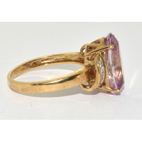 276 - A 9ct gold ladies Amethyst sweep ring set, with Diamond chip shoulders 
Size O