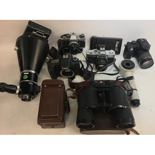 96 - Box of various cameras to include - Canon - Kodak - Finepix with some Nikon apparatus and pair of bi... 