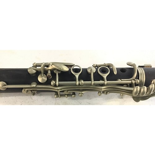 104 - Vintage clarinet complete with original case and music book.