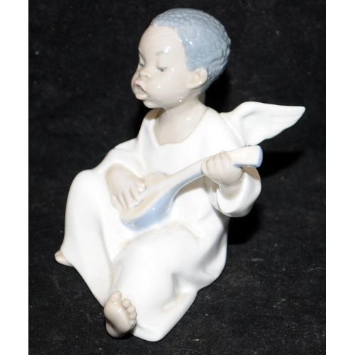 133 - Lladro figure Seated Angel lute Player together a Nao figure Daisa girl holding a puppy