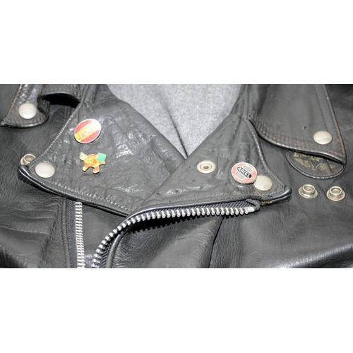 118 - Lewis leather motorbike jacket and badges. 27