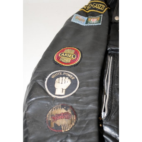 118 - Lewis leather motorbike jacket and badges. 27