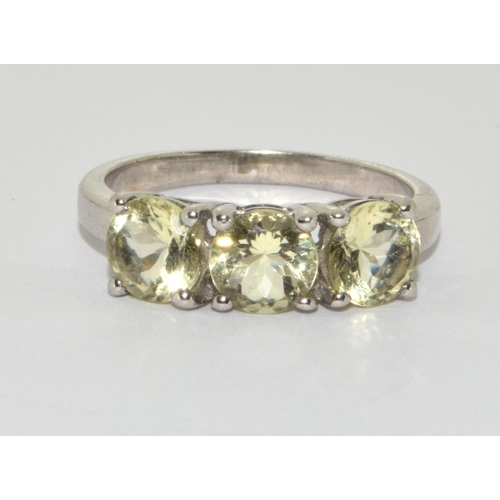 292 - A 925 silver peridot trilogy ring Size P