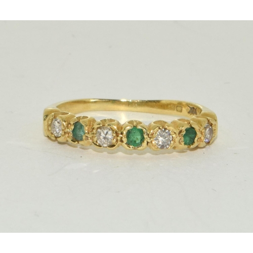 351 - Emerald and Diamond 1/2 eternity ring in 18ct gold ring Size O