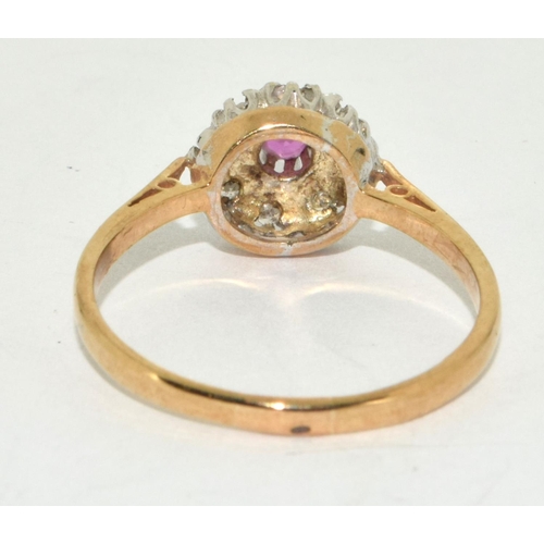 241 - 9ct gold ladies diamond and Ruby ring size Q