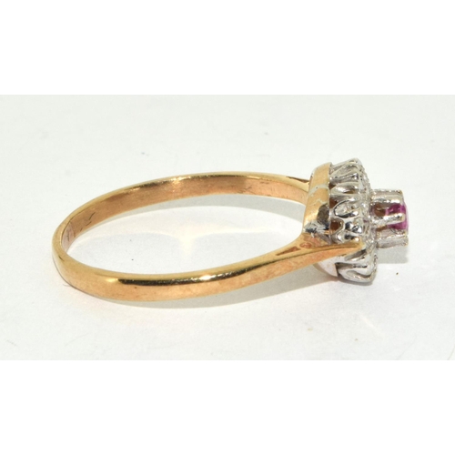 241 - 9ct gold ladies diamond and Ruby ring size Q