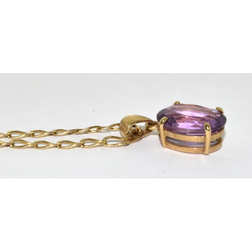 314 - 9ct gold pendant necklace set with large Amethyst stone chain 48cm