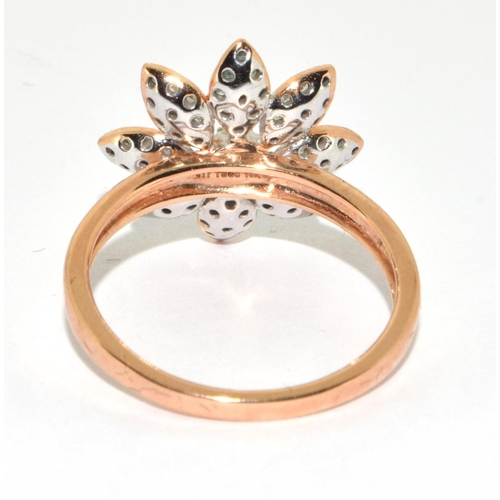 355 - 9ct gold ladies flower head Diamond ring size P