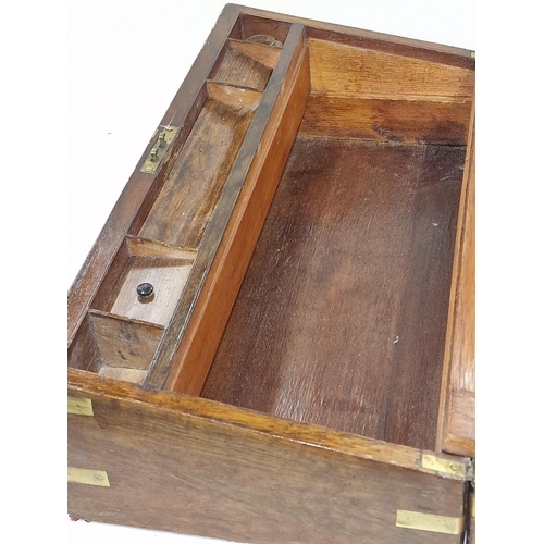 144 - Large mahogany campaign writing slope having brass fitments and fitted  inside