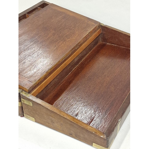 144 - Large mahogany campaign writing slope having brass fitments and fitted  inside